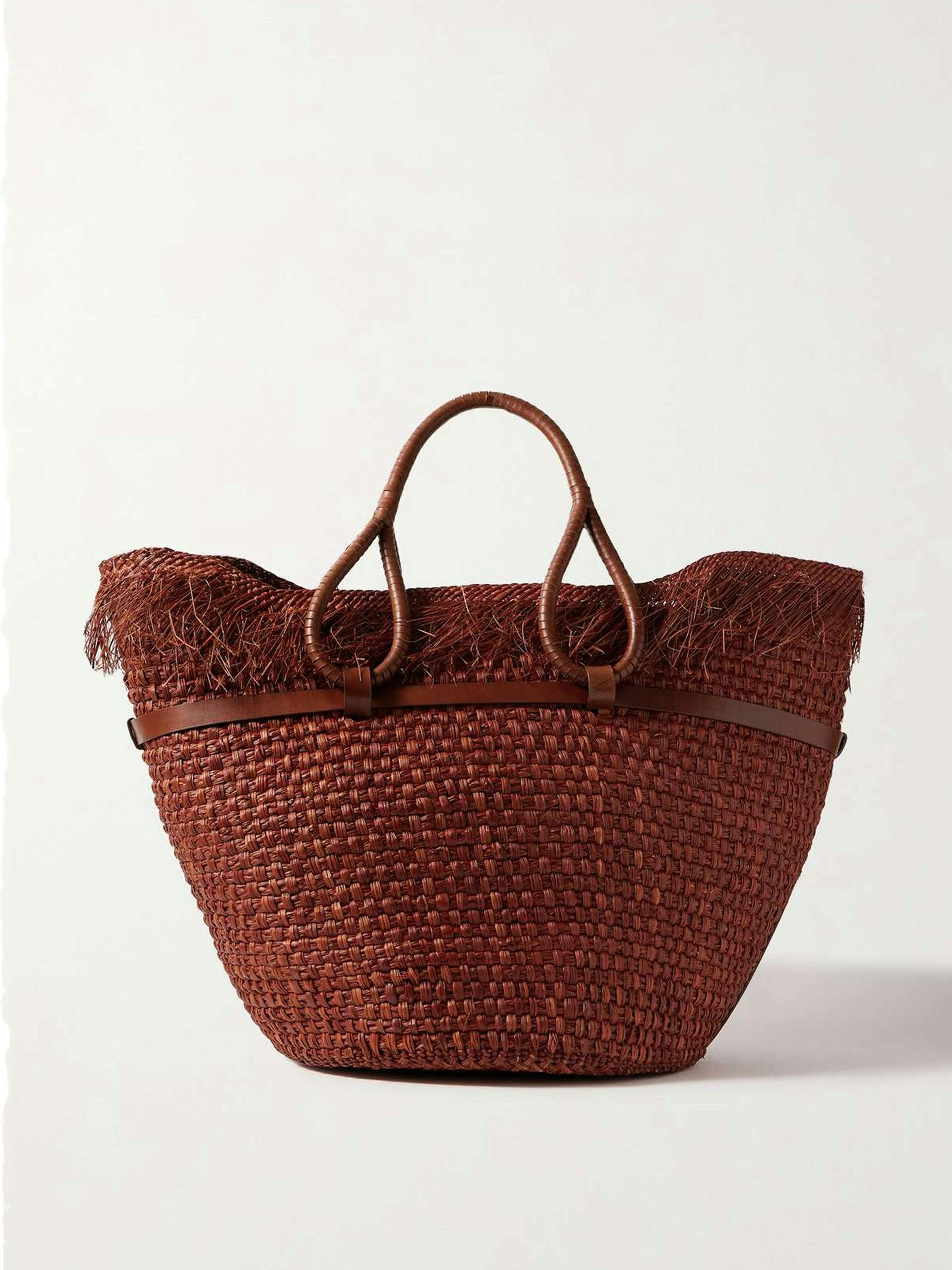 Leather-trimmed fringed woven straw tote bag