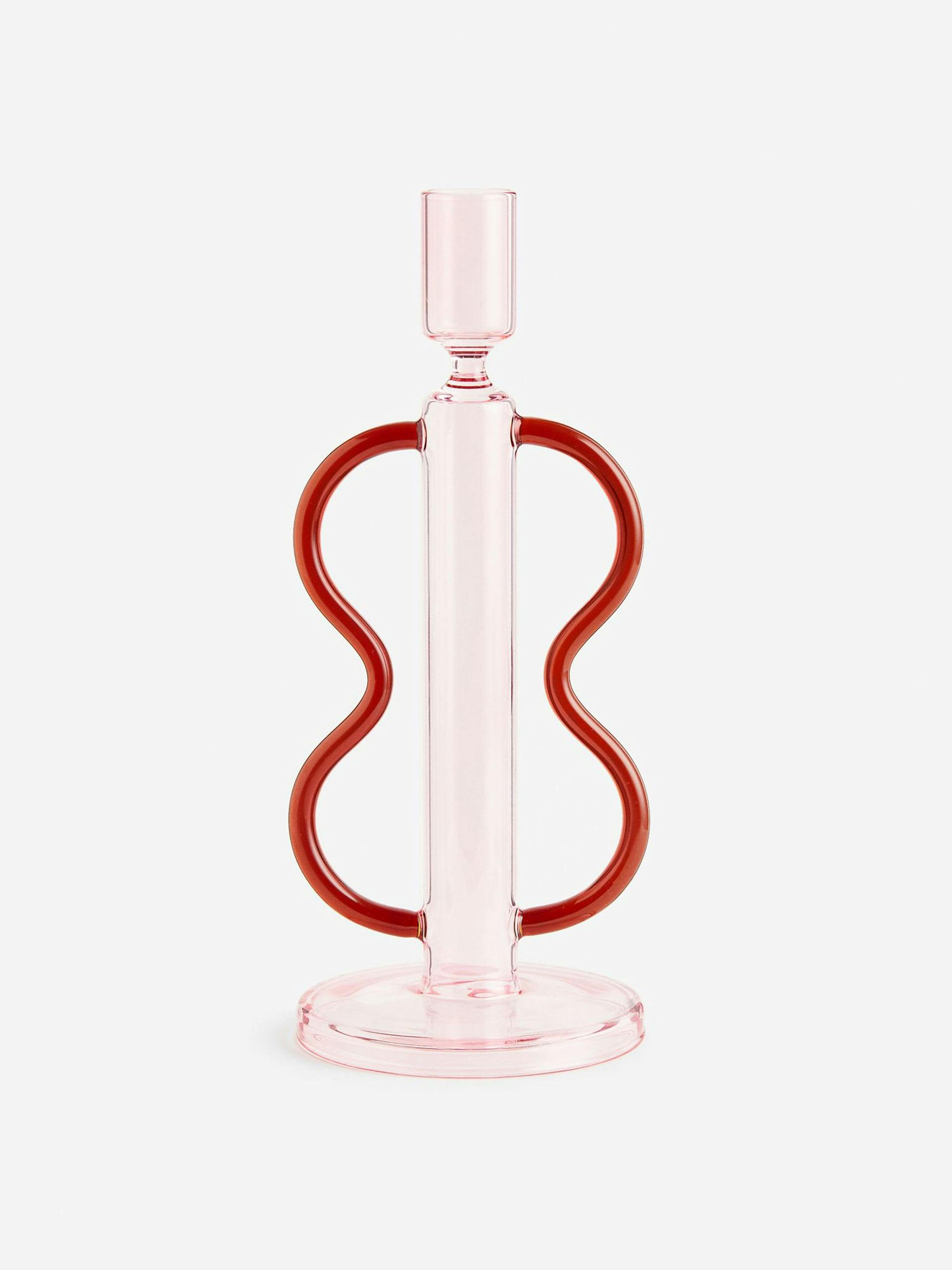 Glass candlestick with red swirl handles